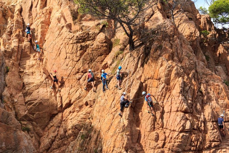 people climbing on the mountain
